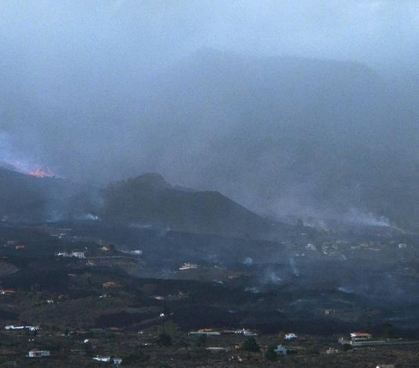 The Cumbre Vieja volcano covered by the cloud of smoke and ash. Image taken in the visible range with a Nikon camera. The Cumbre Vieja volcano covered by the cloud of smoke and ash. Image taken in the visible range with a Nikon camera.