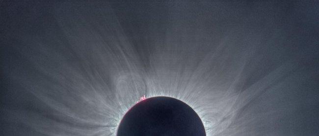Image of the Sun taken form Palau, Indonesia on 9th March 2016. The corona is fairly symmetric, because the Sun was at a phase of high activity. The prominences in the chromosphere (red) can also be seen. Credit: J.C: Casado.