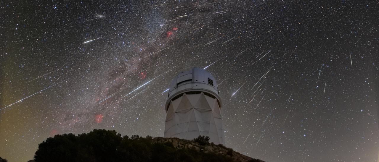 DESI observes the sky from the Mayall Telescope, shown here during the 2023 Geminid meteor shower.  Credit: KPNO/NOIRLab/NSF/AURA/R. Sparks