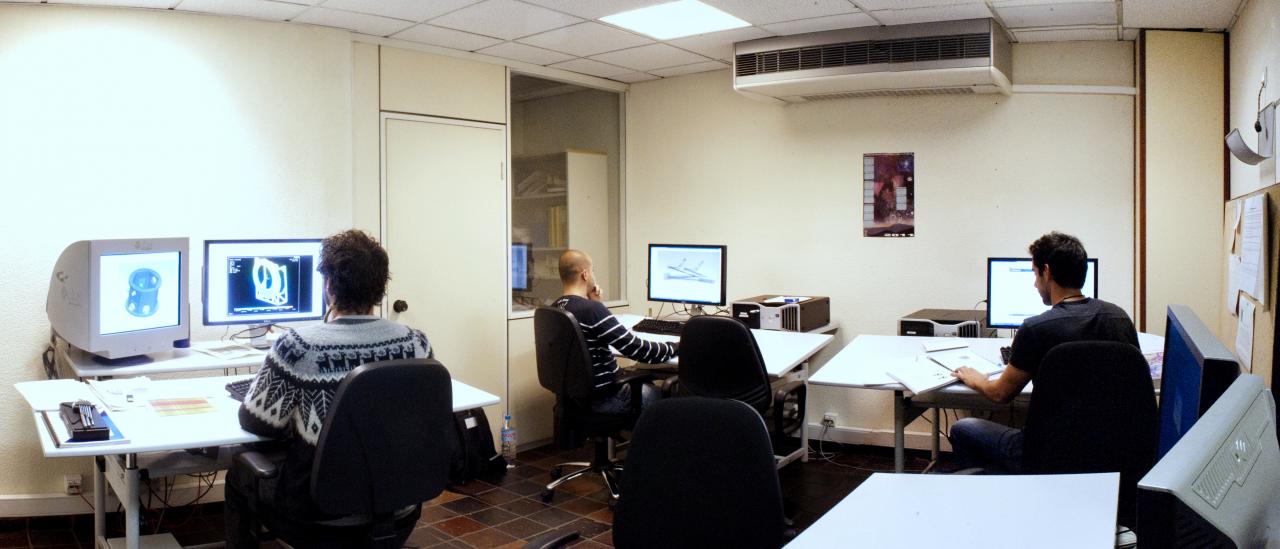 Panoramic view of the CAD studio with engineers working with desktop computers