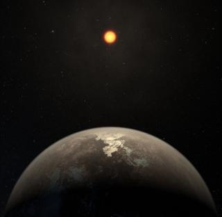 Impresión artística que muestra el planeta templado Ross 128 b con su estrella enana roja al fondo. Crédito: ESO/M. Kornmesser