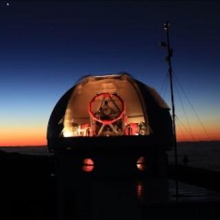 The SONG Telescope at Teide Observatory in morning light during a full moon night. (Photo: Uli Fehr, www.fehrpics.com)  