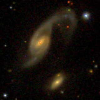 Multiband image of the interacting pair Arp 70 obtained from the SDSS archive. On the left, Arp 70b, the galaxy studied in this work. Credit: SDSS Multiband image of the interacting pair Arp 70 obtained from the SDSS archive. On the left, Arp 70b, the galaxy studied in this work. Credit: SDSS
