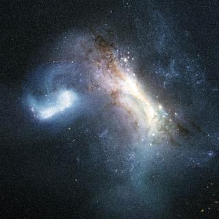 An artist’s impression of the collision between a dwarf galaxy known as LKH (left) and a young Milky Way (right), some 12 billion years ago.
