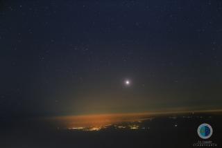 Wide angle view from the Teide Observatory towards the east. Above the horizon you can see the planet Venus, an a little higher up and to the left of Venus is comet Catalina (C/2013 US10). The lights and villages are on Grand Canary. J.C. Casado-staryeart