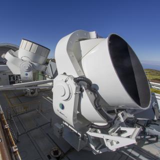 The image shows the first QUIJOTE telescope (QT1) in the back, and the second telescope (QT2) in the front. Image taken by Daniel Lopez The QUIJOTE experiment at the Teide Observatory