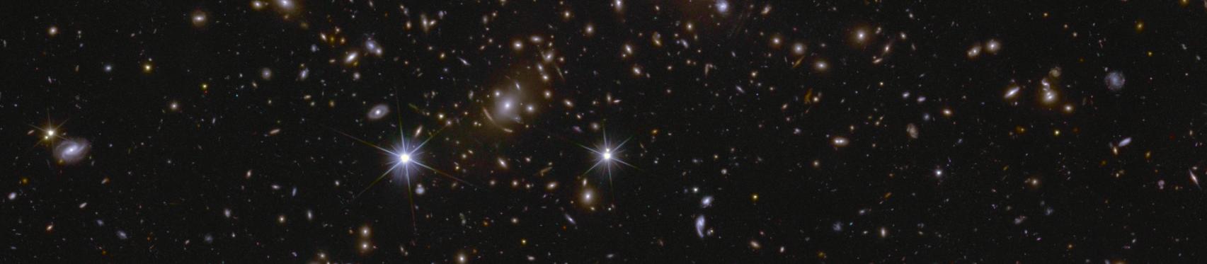 Image of an area of the Euclid Deep Field South showing several huge galactic clusters, as well as intracluster light and gravitational lensing.